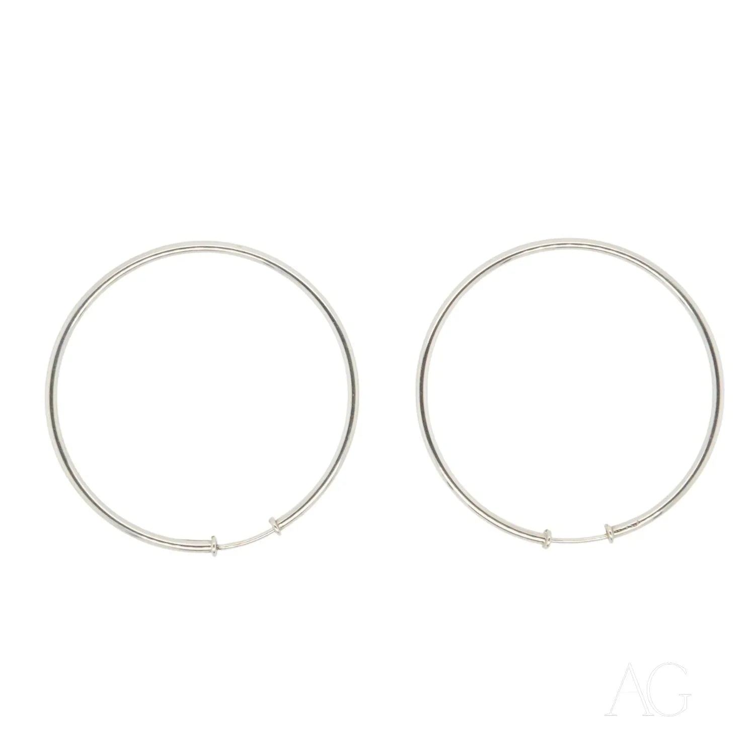 Pair of thin circular 18k White Gold Hoop Earrings showcasing elegant luxury design