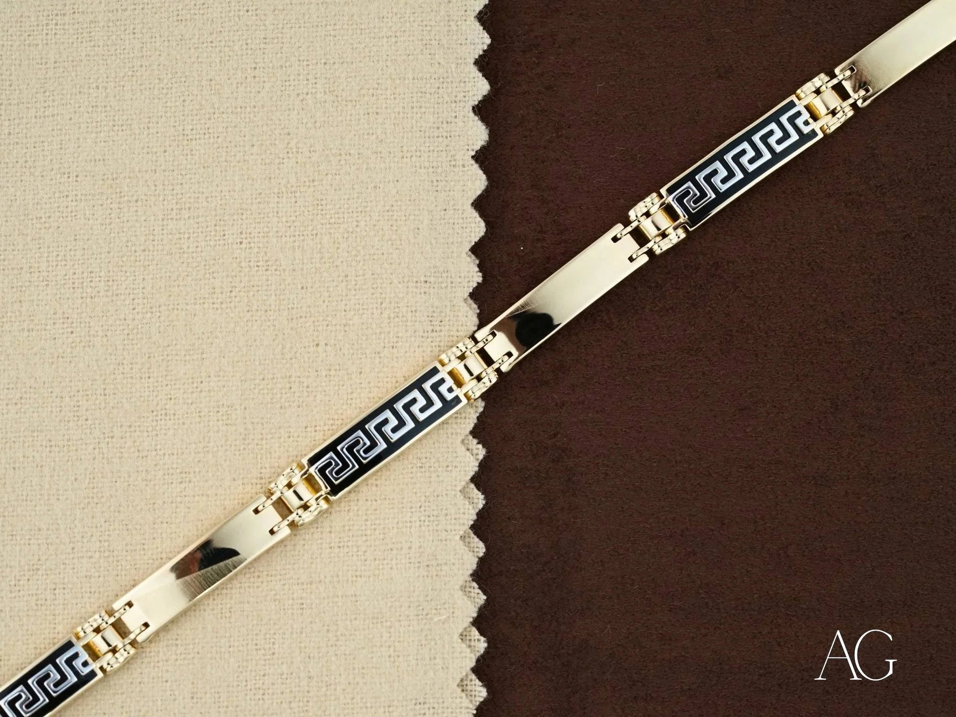 Decorative bracelet featuring a Greek key pattern in blue and gold with 18k gold accents