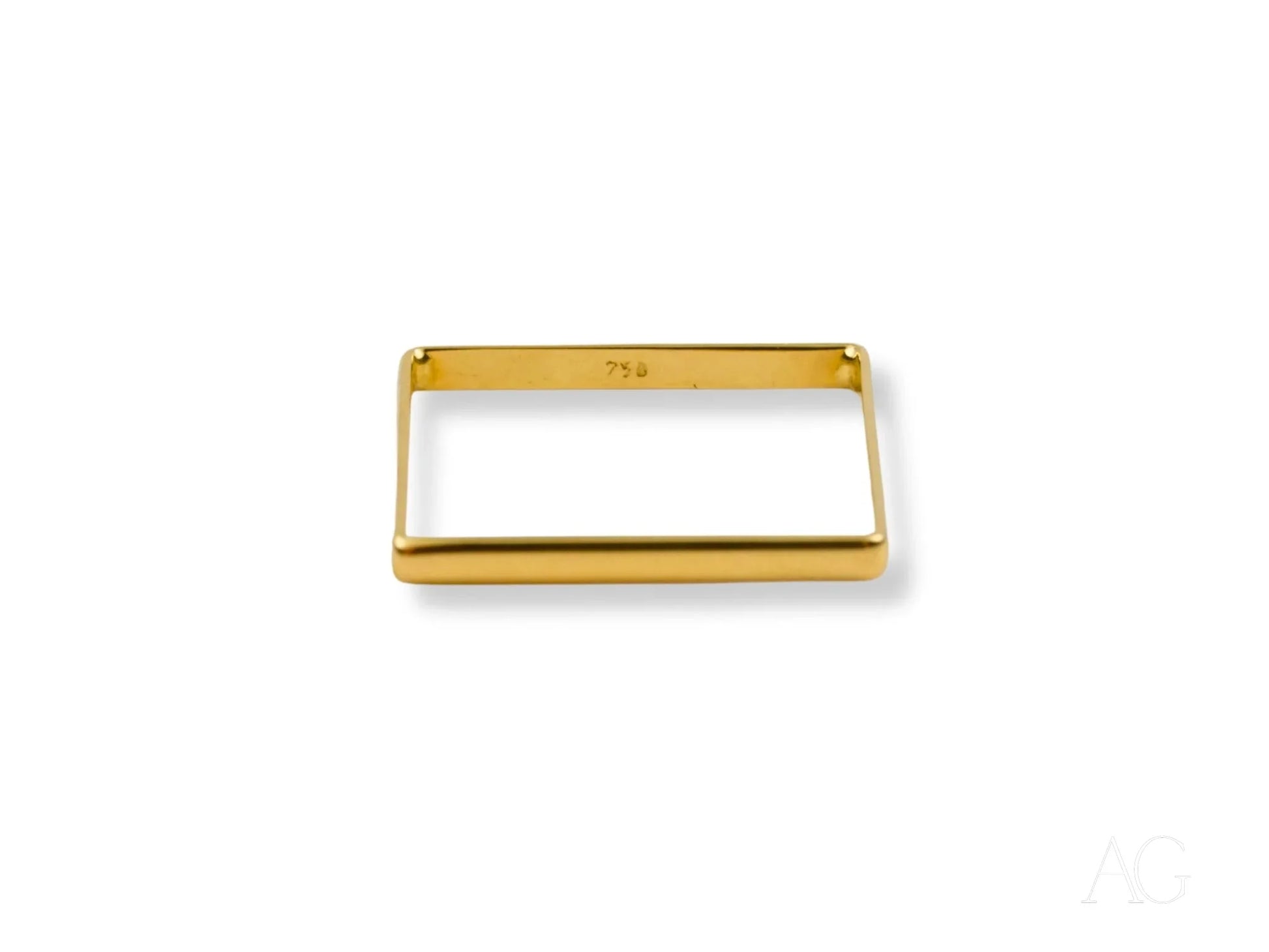 Gold-colored rectangular frame highlighting a square shape 18k gold ring