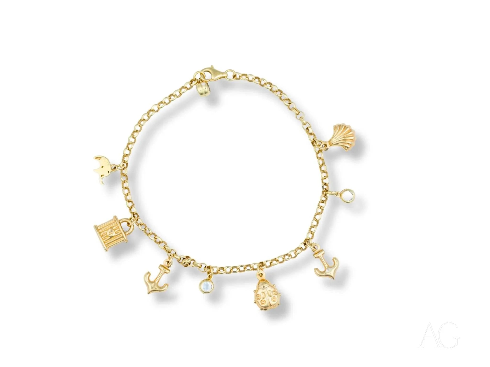 18k gold charm bracelet featuring sea-inspired charms and pearls for nautical elegance