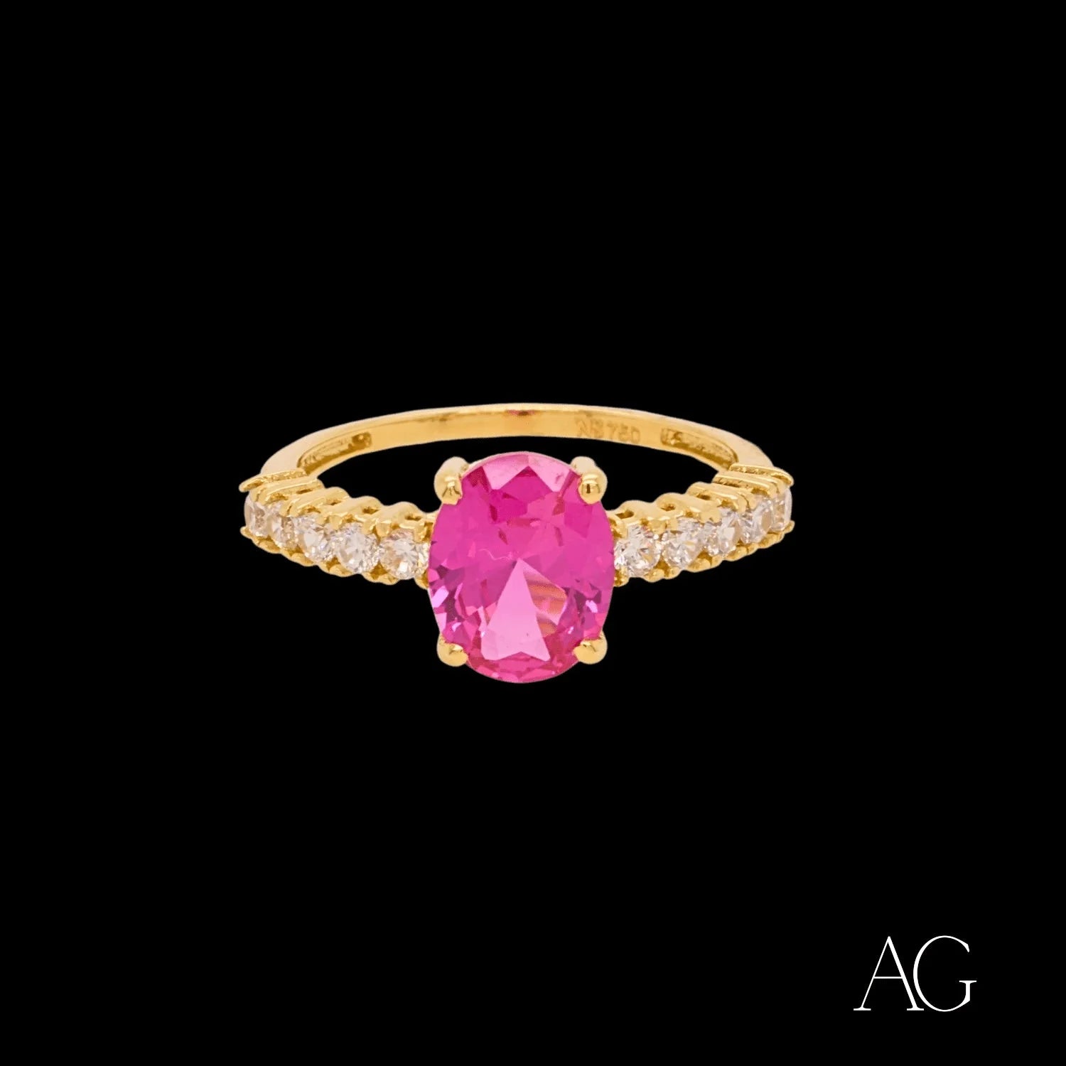 18k gold oval-shaped ring with pink gemstone and clear stone accents