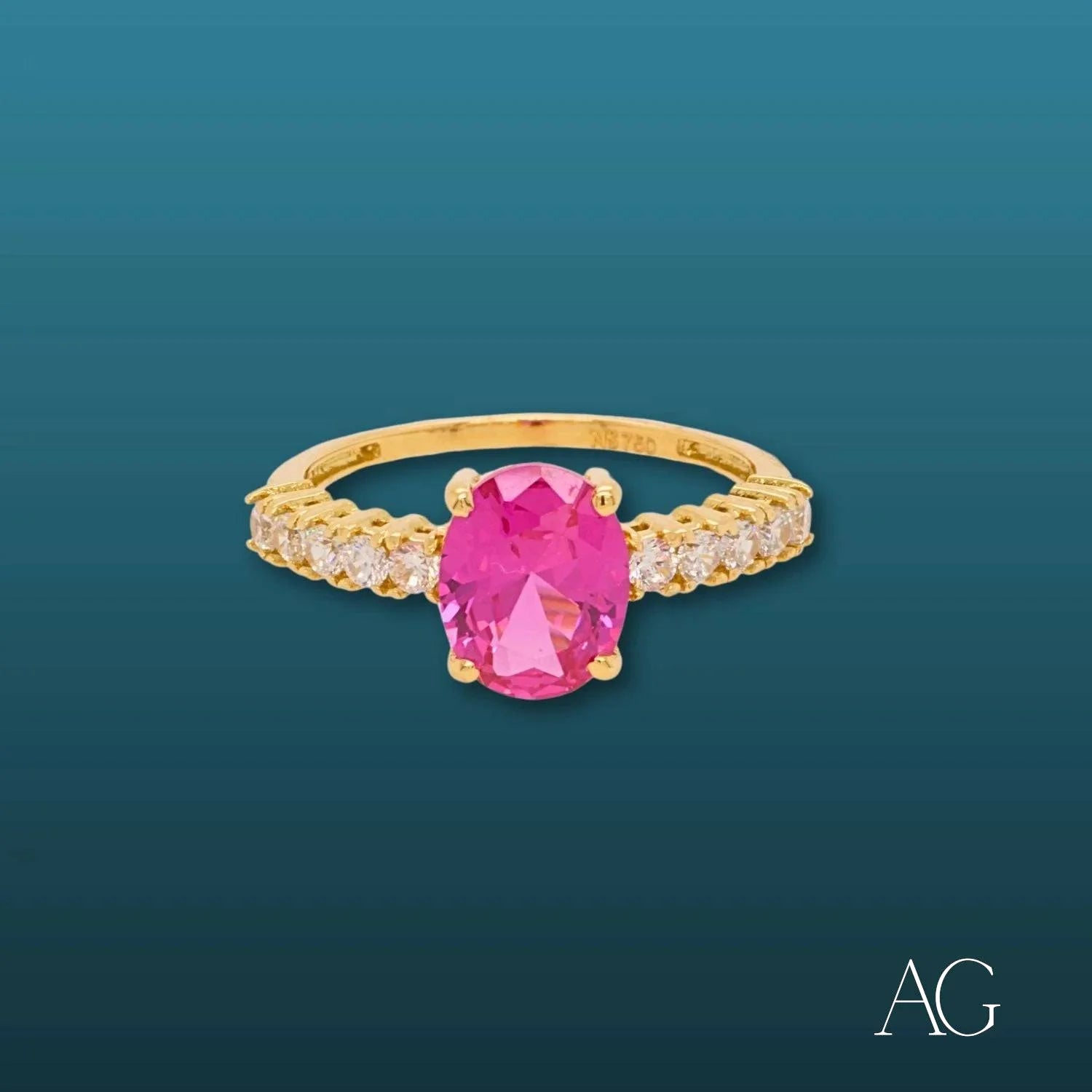 18k gold oval-shaped ring with pink gemstone center and clear stone accents