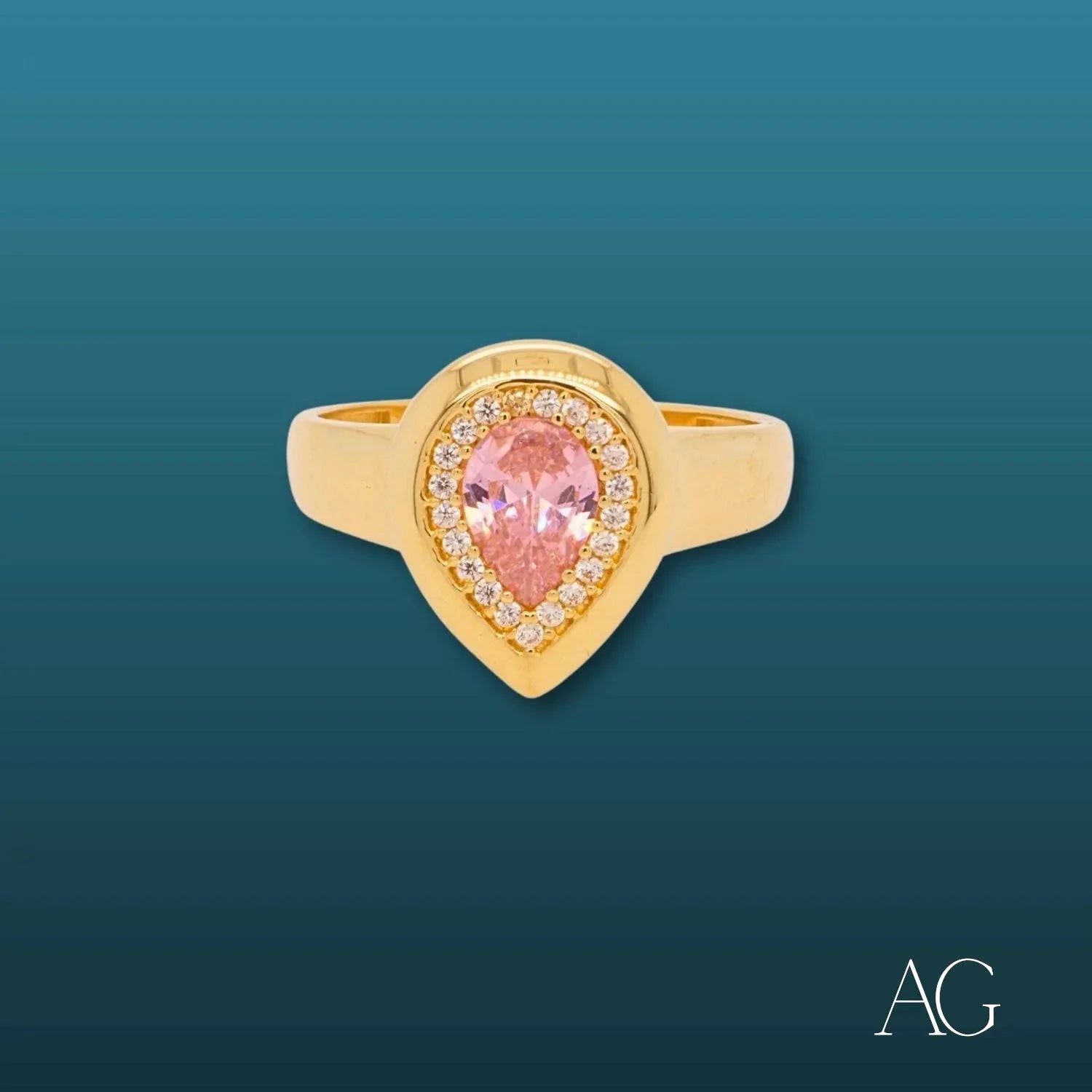 Gold ring with pear-shaped pink gemstone and white CZs in 18k gold setting