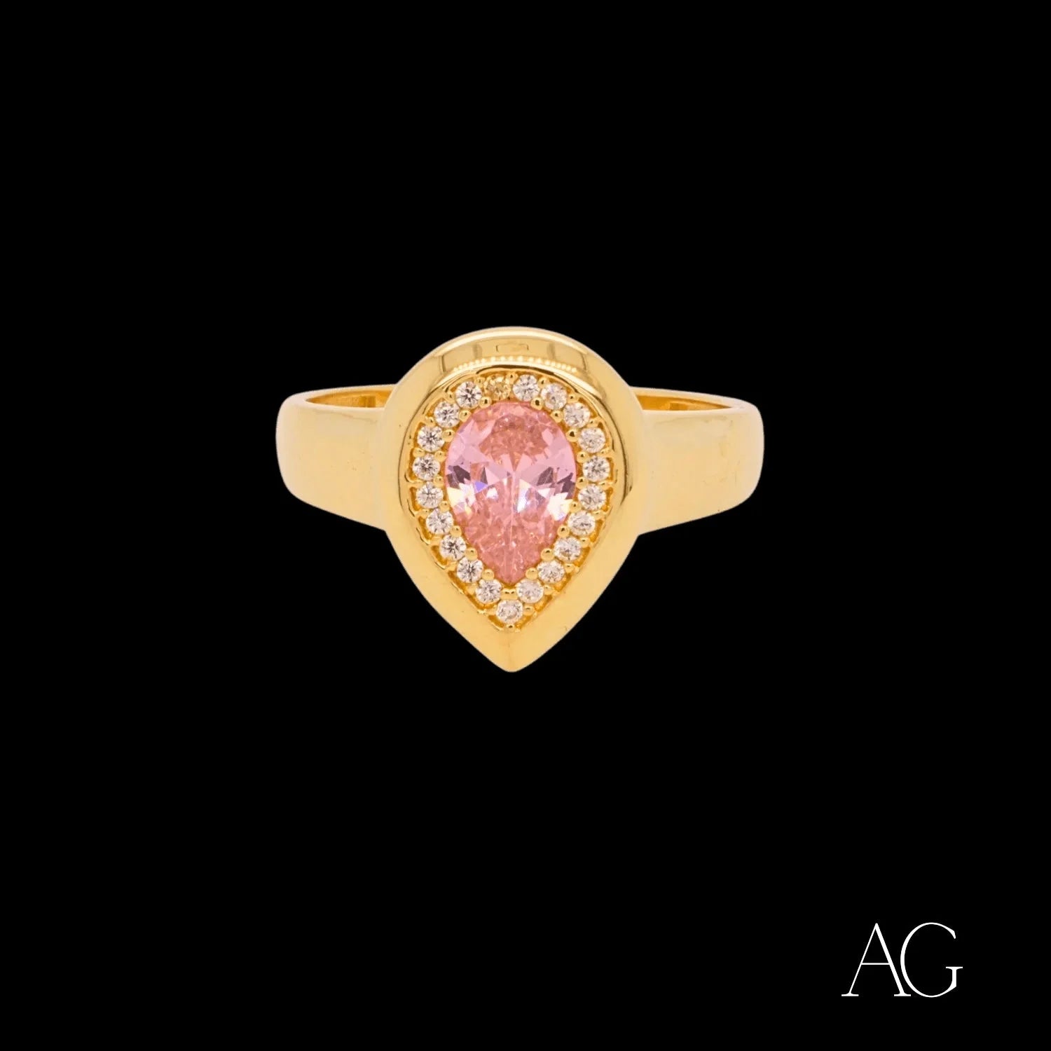 Gold ring with pear-shaped pink gemstone and white czs in 18k gold setting