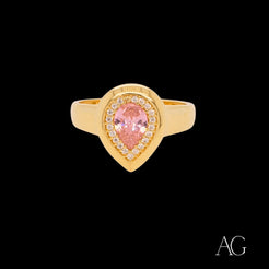 Gold ring with pear-shaped pink gemstone and white czs in 18k gold setting