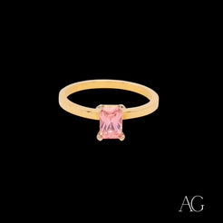 Gold ring featuring a rectangular pink cubic zirconia in 18k gold setting