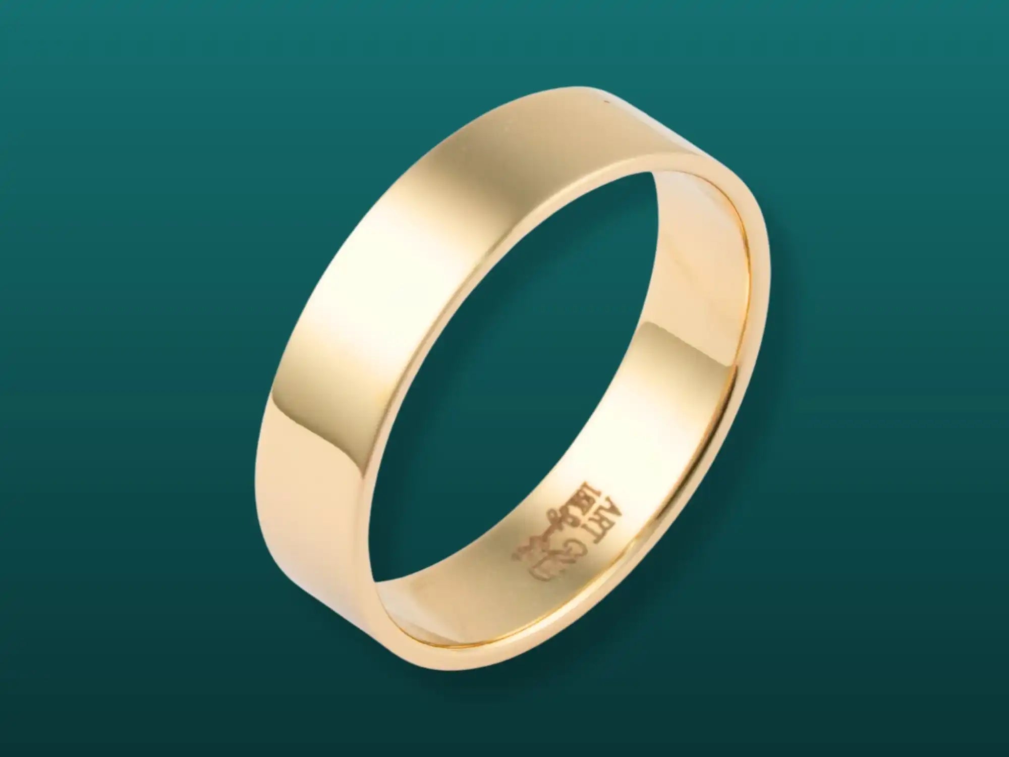 Plain gold wedding band with a polished finish.