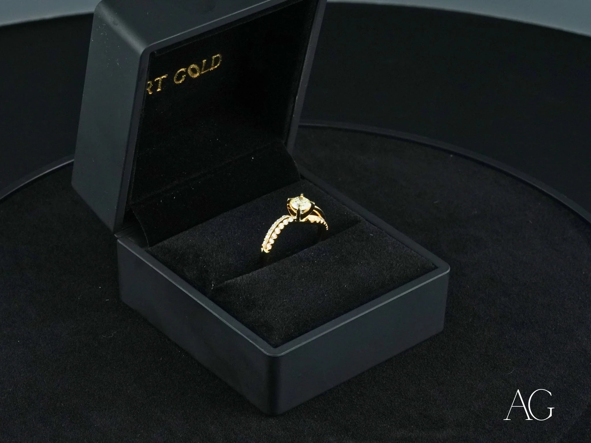 Gold Radiant Vow Engagement Ring with center diamond in a black jewelry box