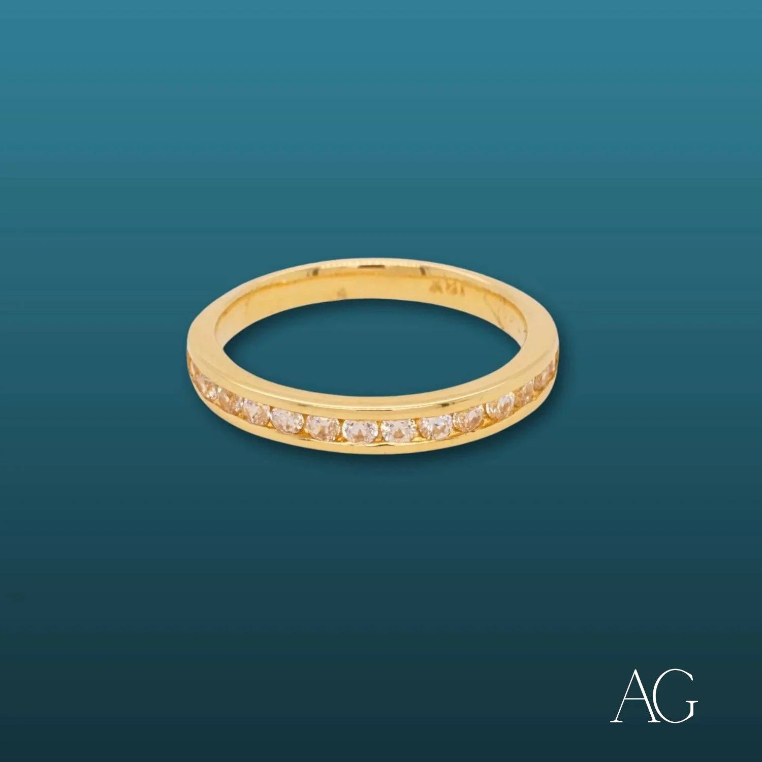 Gold ring adorned with small diamonds in a stunning 18k gold design