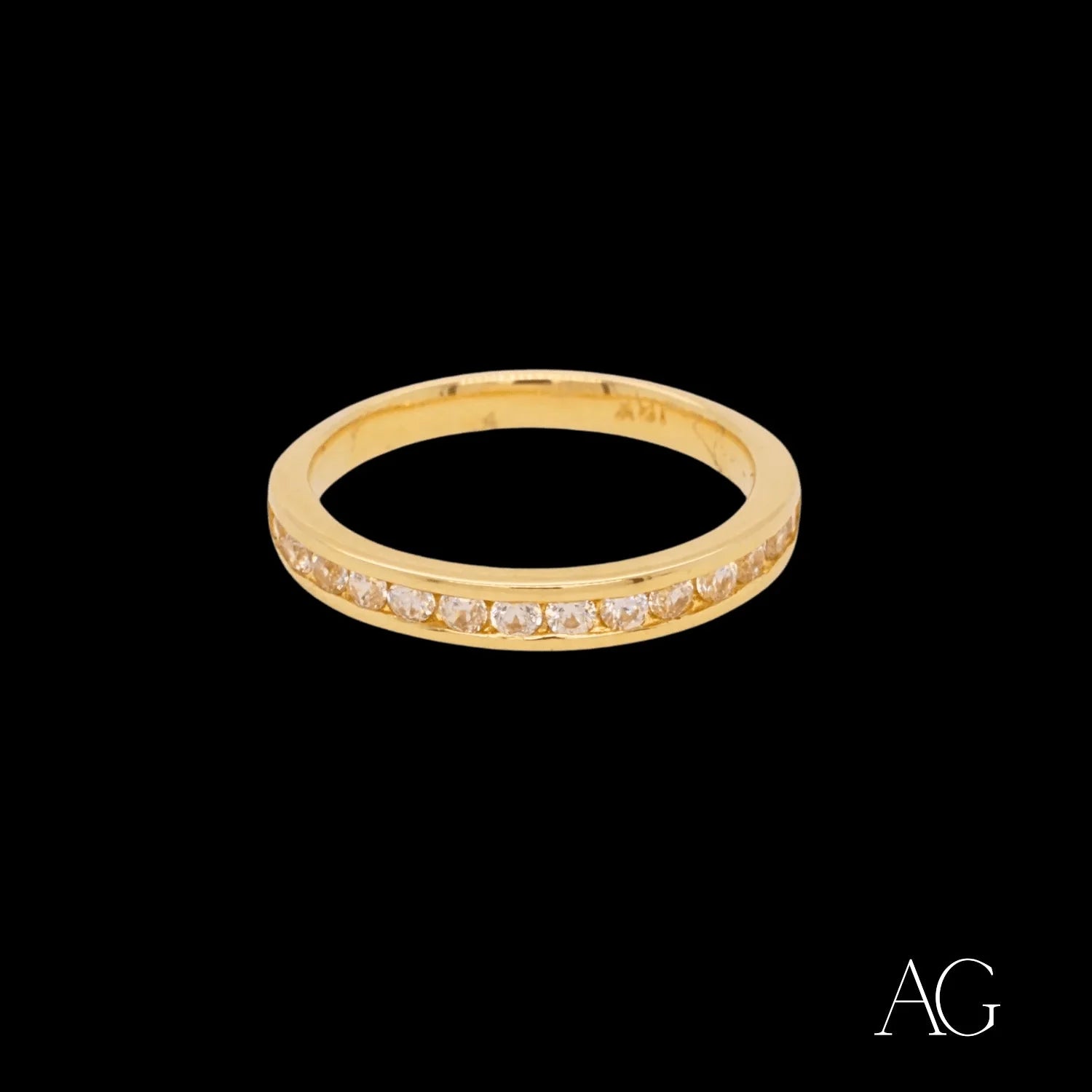 Gold ring adorned with small diamonds in a stunning 18k gold design