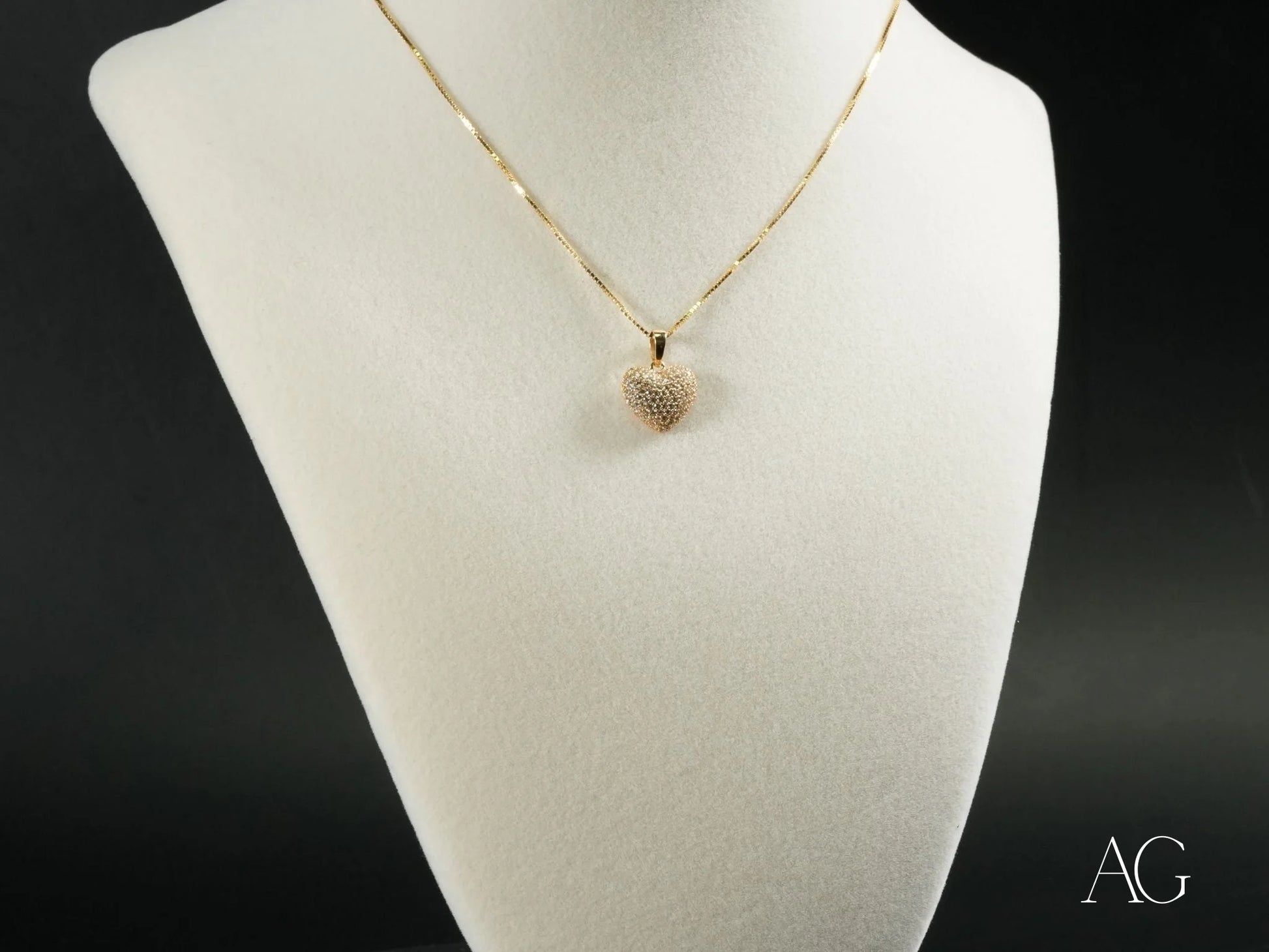 Delicate 18k gold heart pendant necklace featuring a radiant heart design on a thin chain