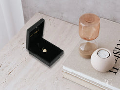 Diamond ring in black velvet box with 18k gold Radiant Heart Pendant