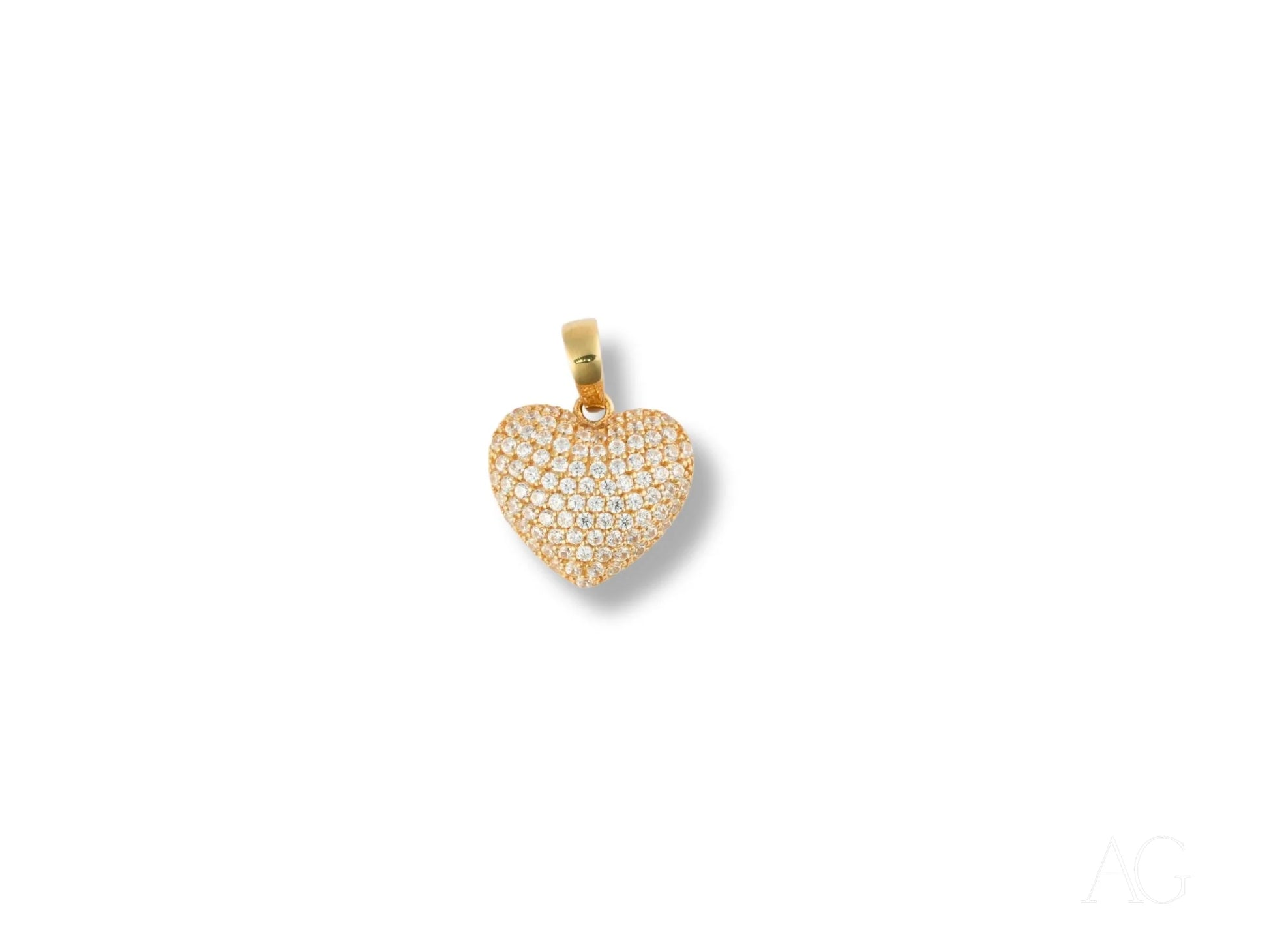 Gold heart pendant encrusted with diamonds, featuring a Radiant Heart design in 18k gold