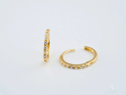 Pair of 18k yellow gold mini hoop earrings adorned with vibrant gemstones