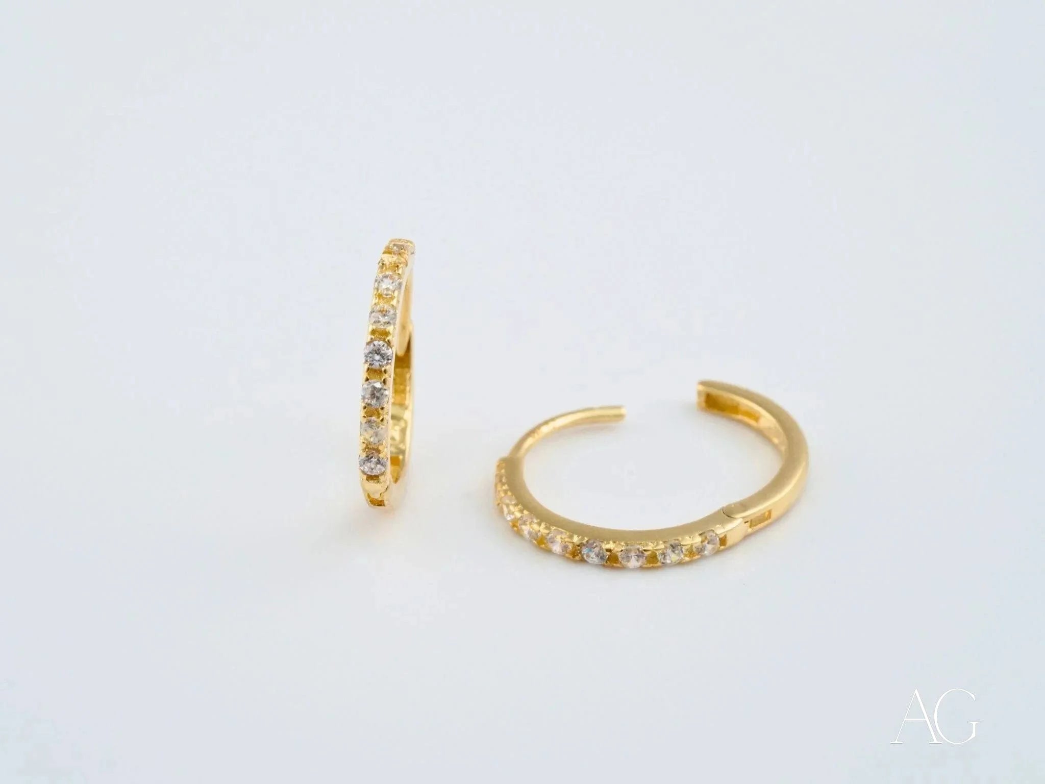 Pair of 18k yellow gold mini hoop earrings adorned with vibrant gemstones