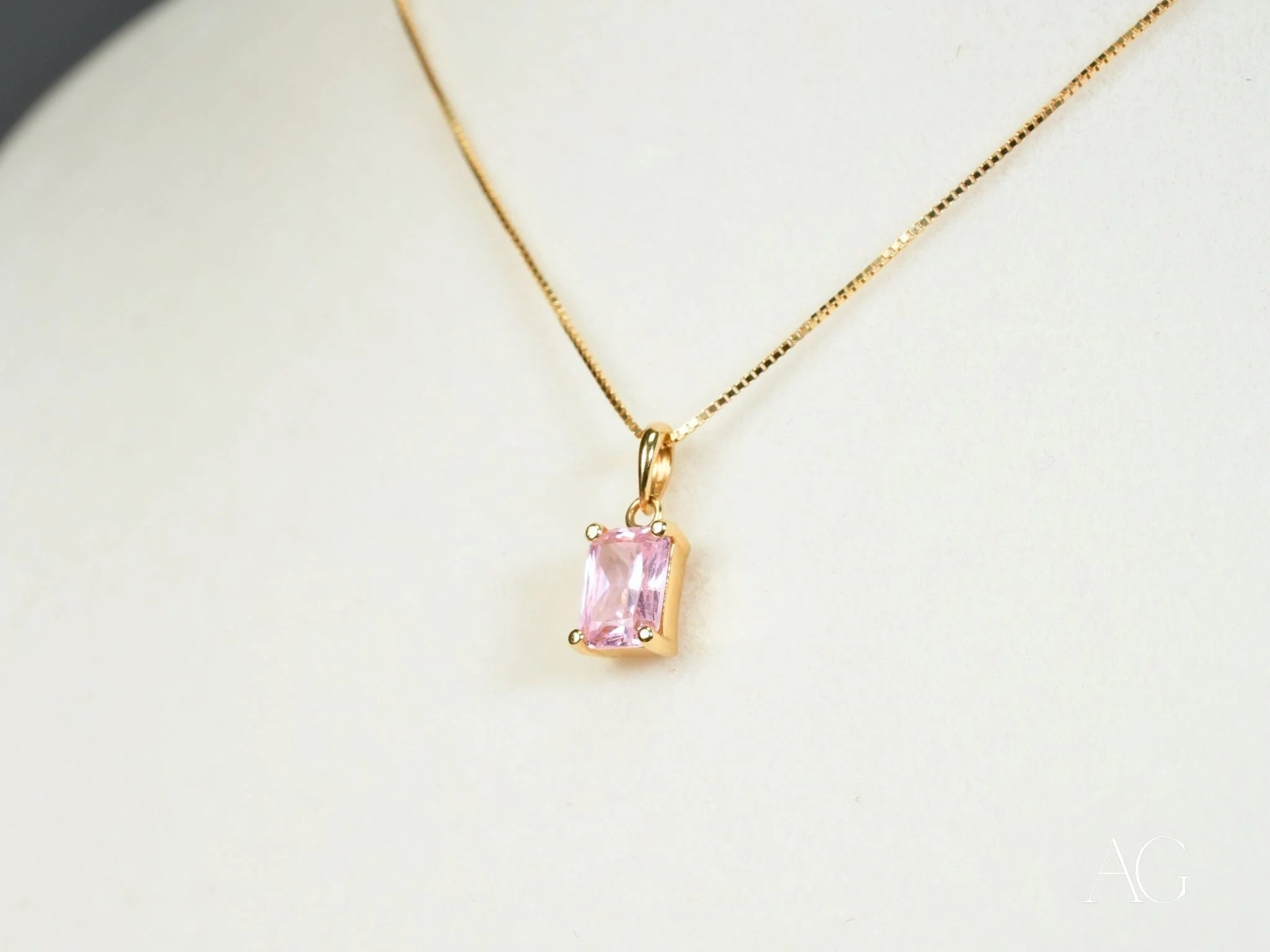 Delicate 18k gold necklace featuring a pink cubic zirconia rectangular pendant