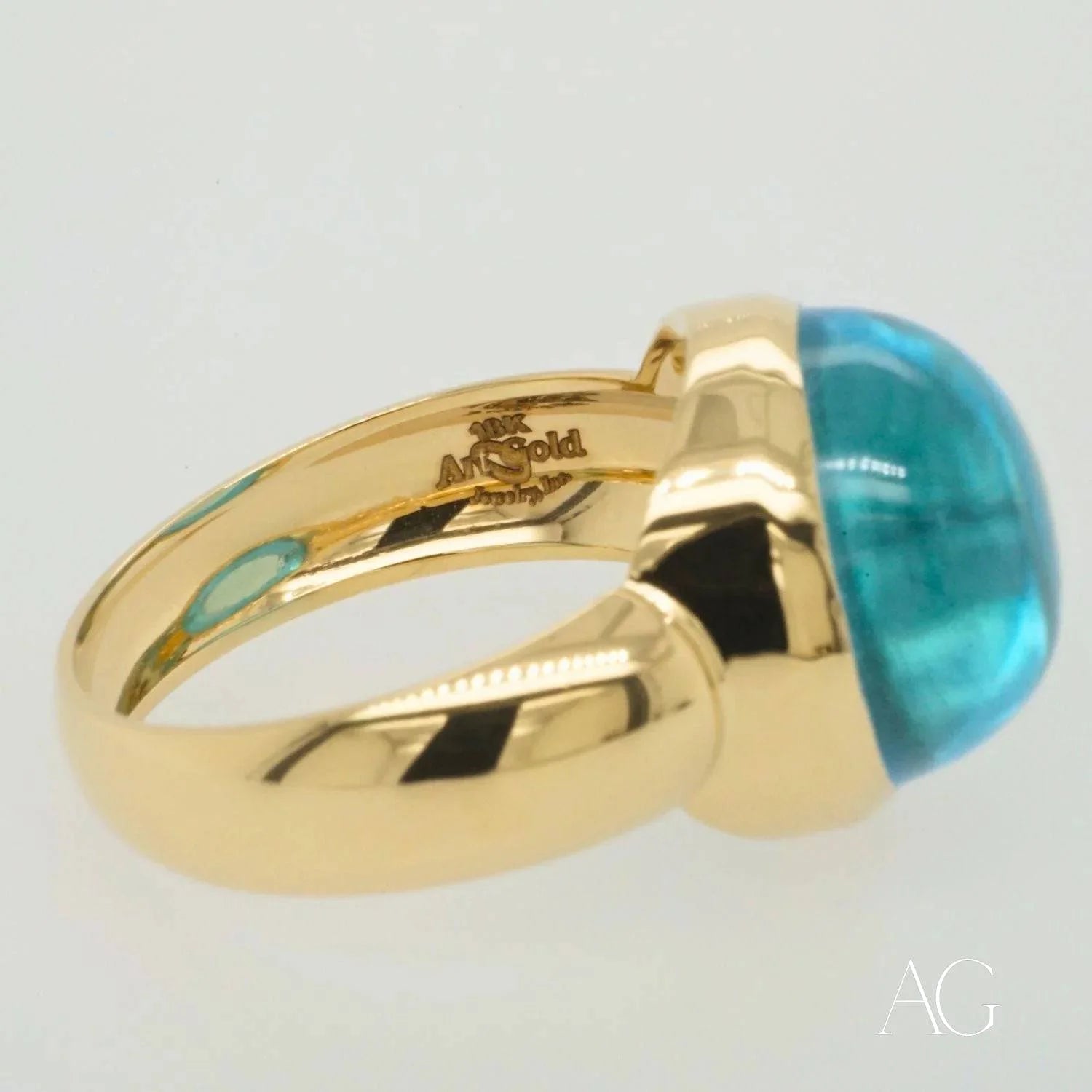 Gold ring with a cabochon blue topaz gemstone in Serenity in Blue collection