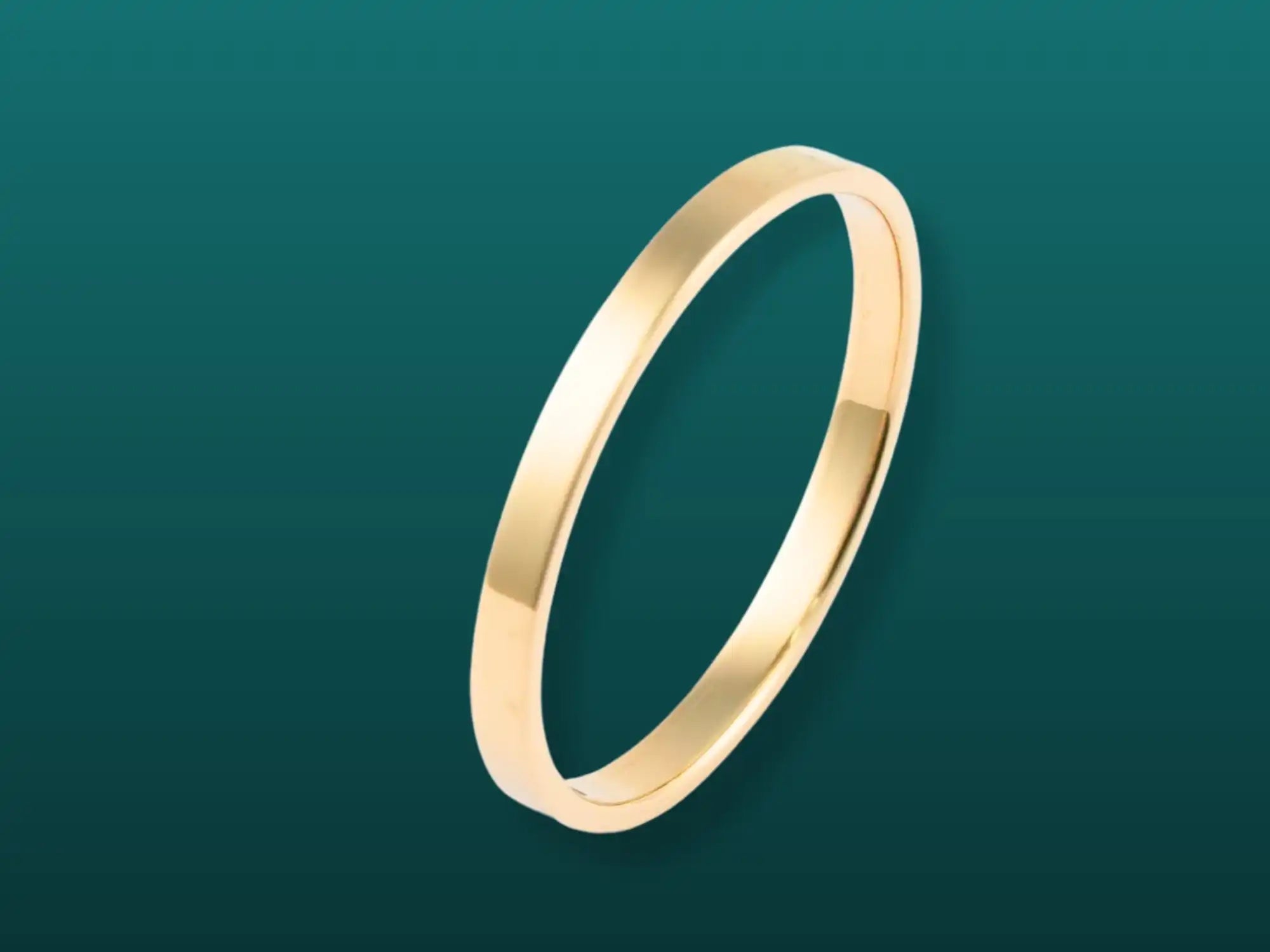 Simple gold wedding band with a plain polished finish.