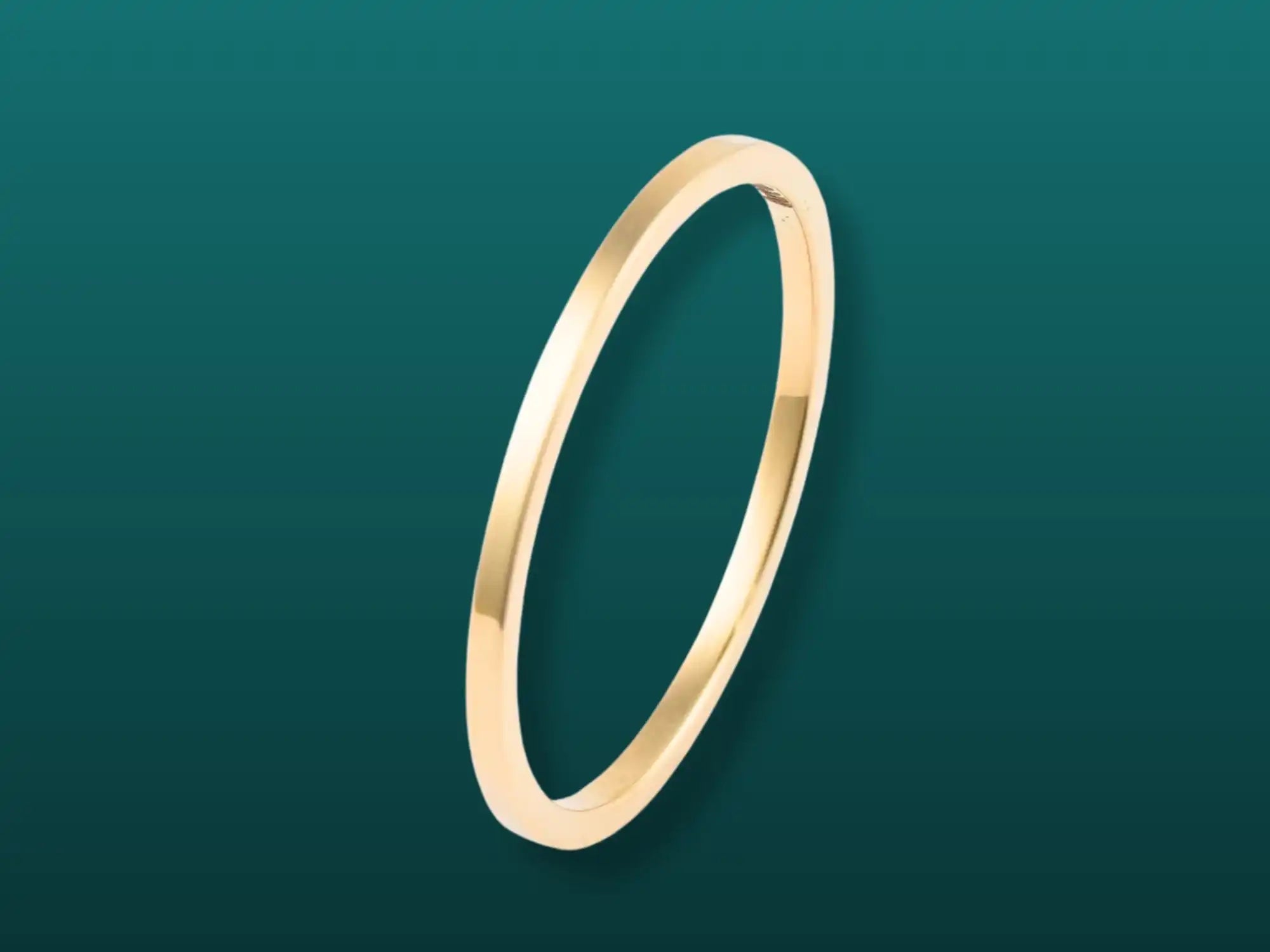 Simple gold band ring.