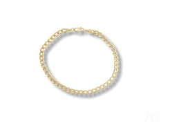 Solid 18k gold Cuban link bracelet featuring interlocking links for luxurious style