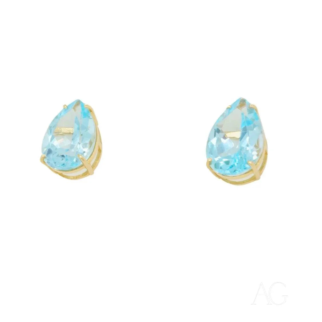 Sophisticated Blue Topaz Gold Earrings featuring light blue teardrop gemstones in gold settings