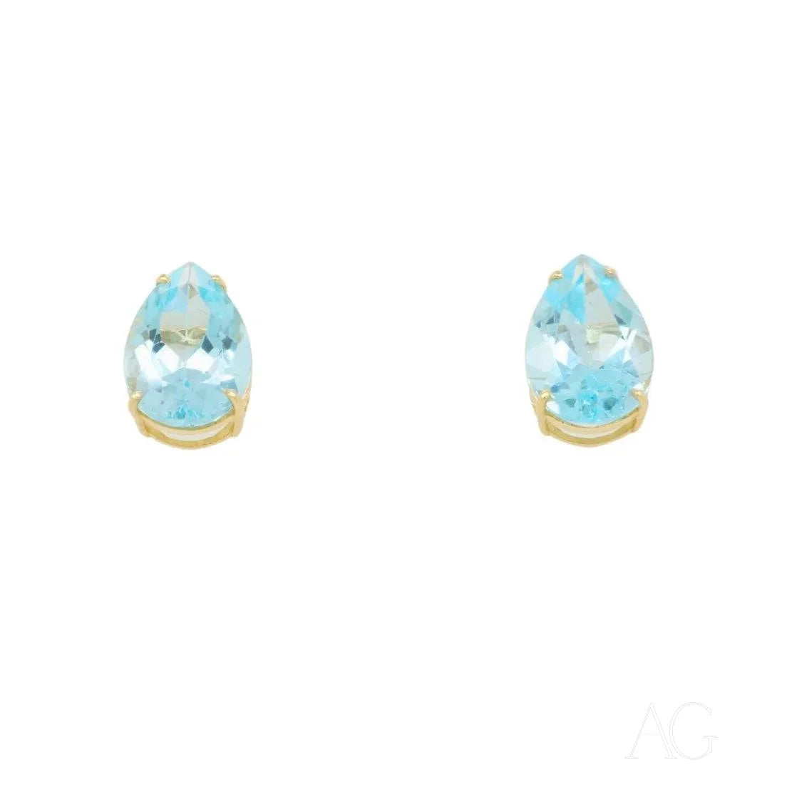 Teardrop-shaped blue topaz gold earrings with elegant gold settings