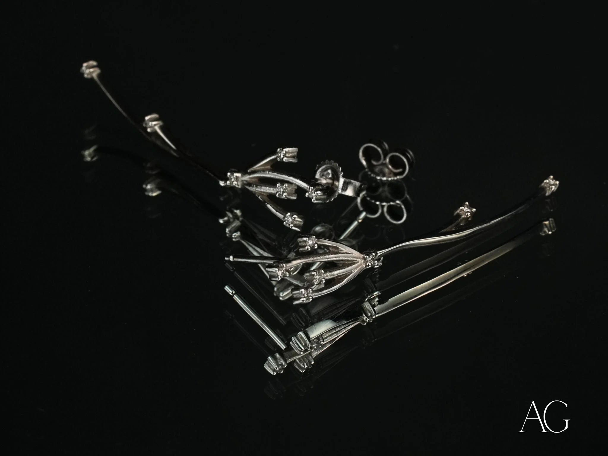Silver floral earrings with post backs from Stellar Bloom, featuring 18k white gold and diamonds