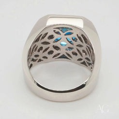 Intricate silver ring featuring Swiss Blue Topaz inlay and elegant cutout design