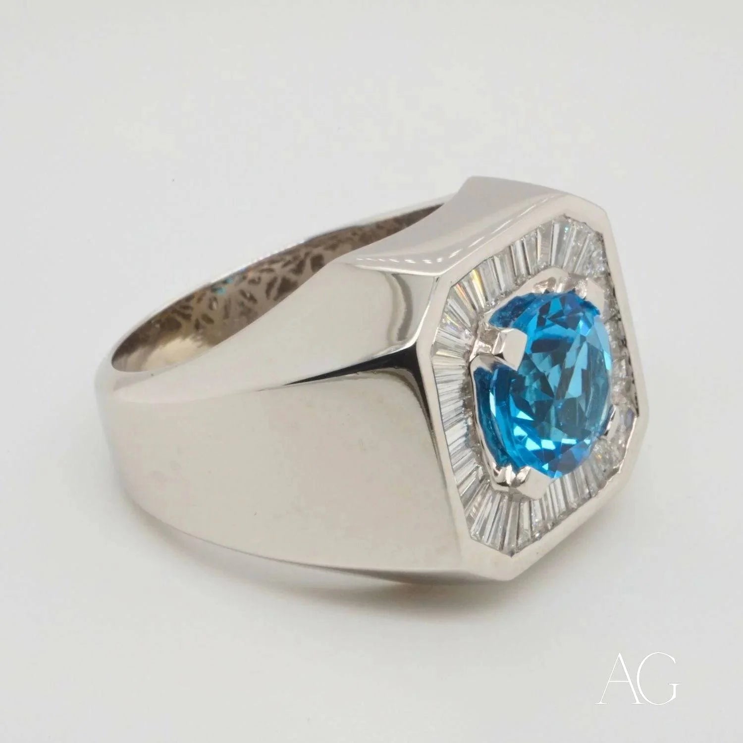 Silver ring with Swiss Blue Topaz centerpiece and clear stone accents for elegance