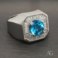 Silver ring with Swiss Blue Topaz and clear stones in a stunning geometric setting