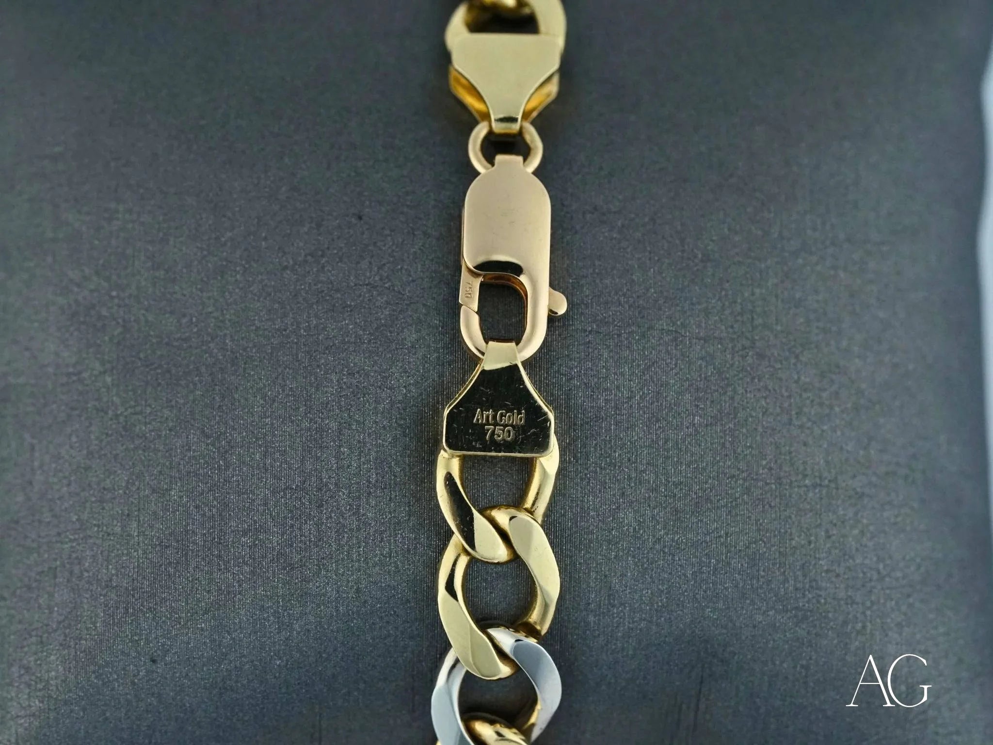 Gold chain bracelet featuring interlocking links in 18k white gold flat cuban design