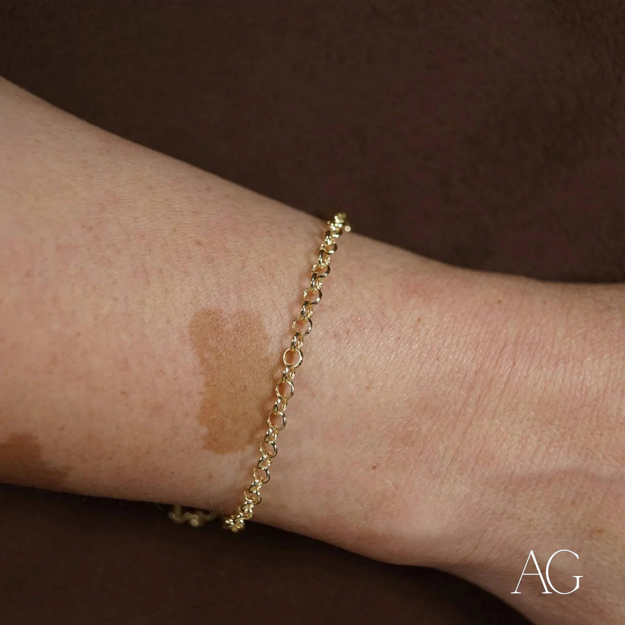 Delicate 18k gold heart bracelet worn on wrist, perfect accessory for kids