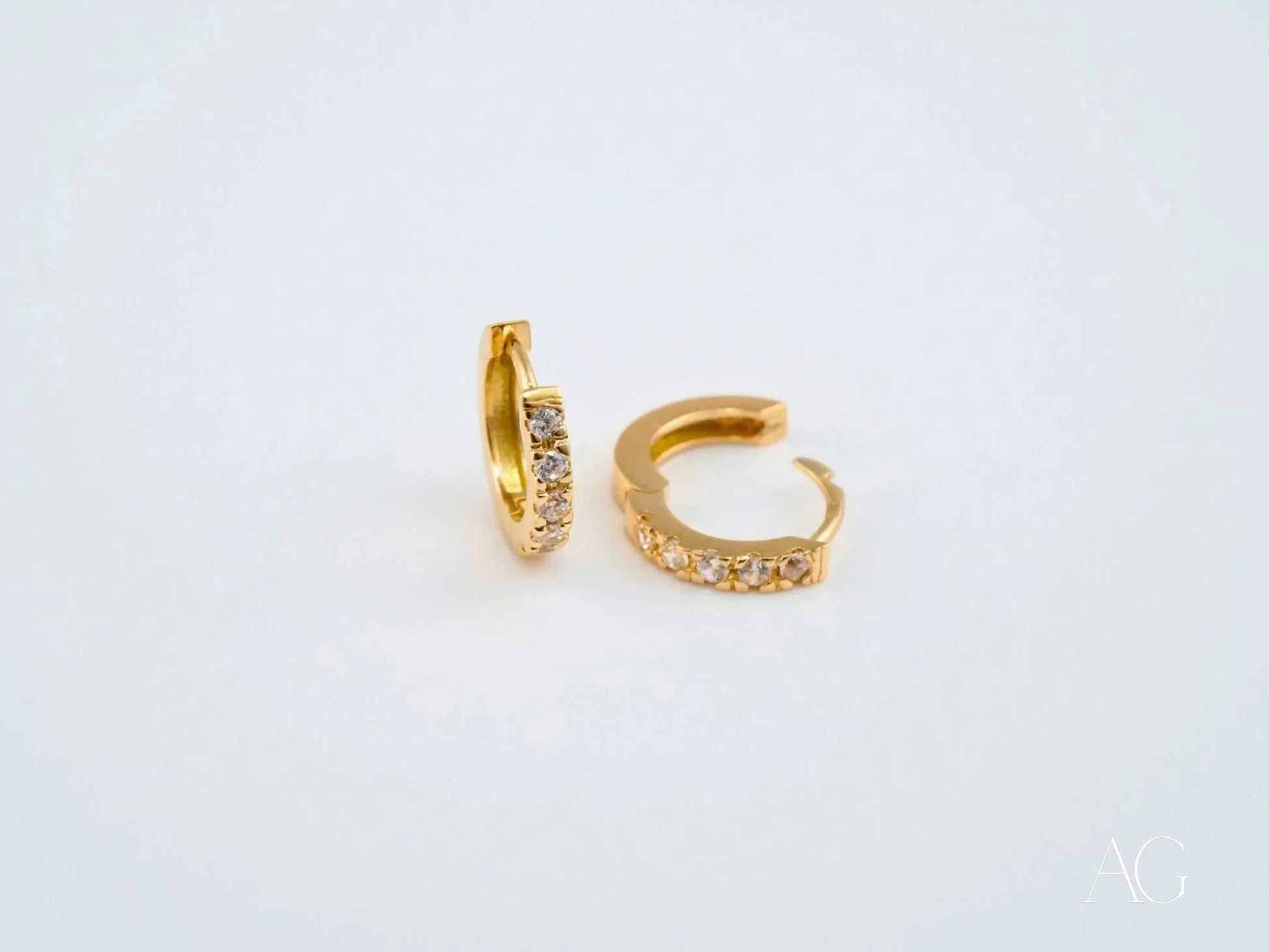 18k yellow gold mini hoop earrings with sparkling diamonds for timeless elegance