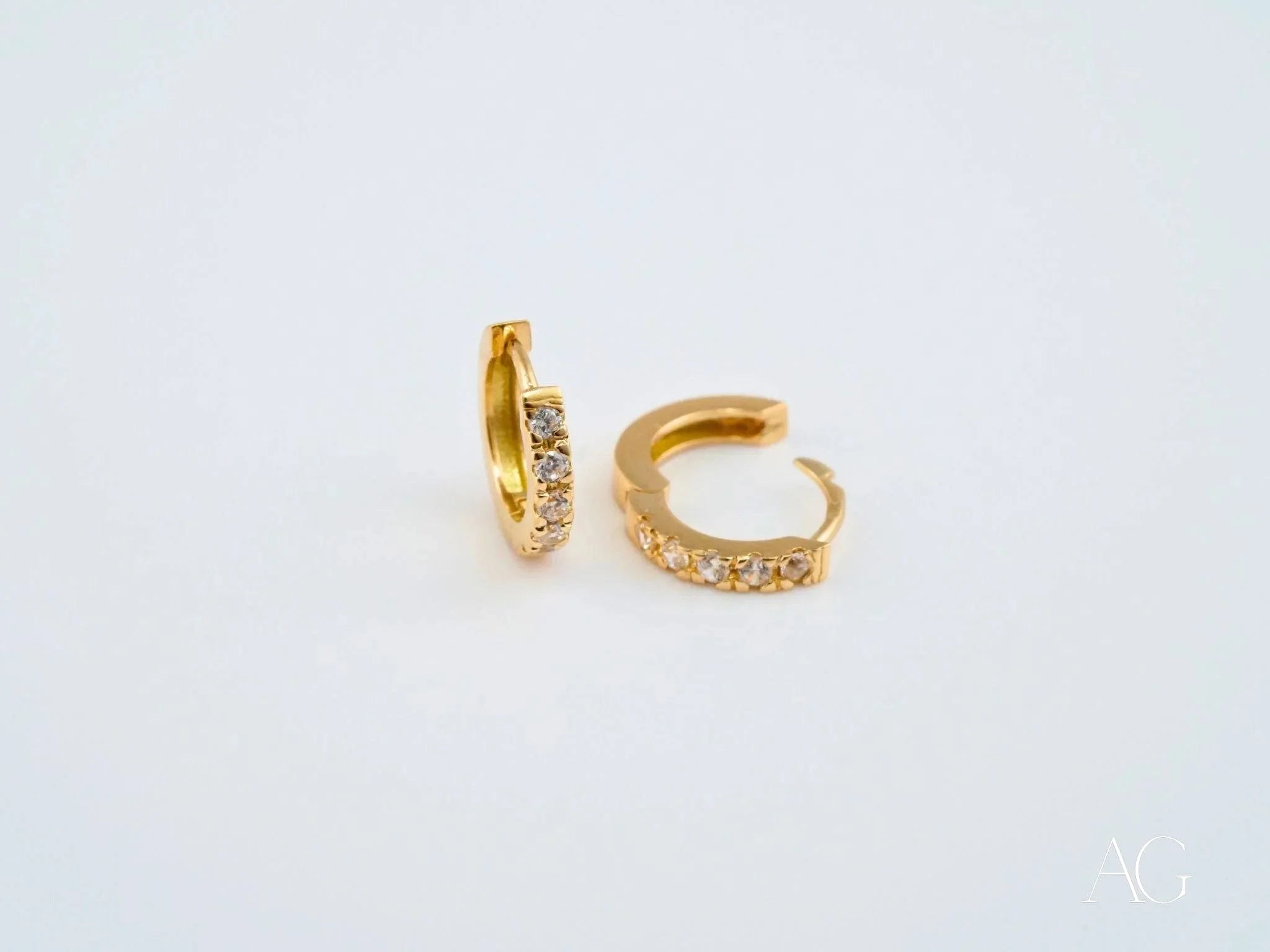 18k yellow gold mini hoop earrings with sparkling diamonds for timeless elegance