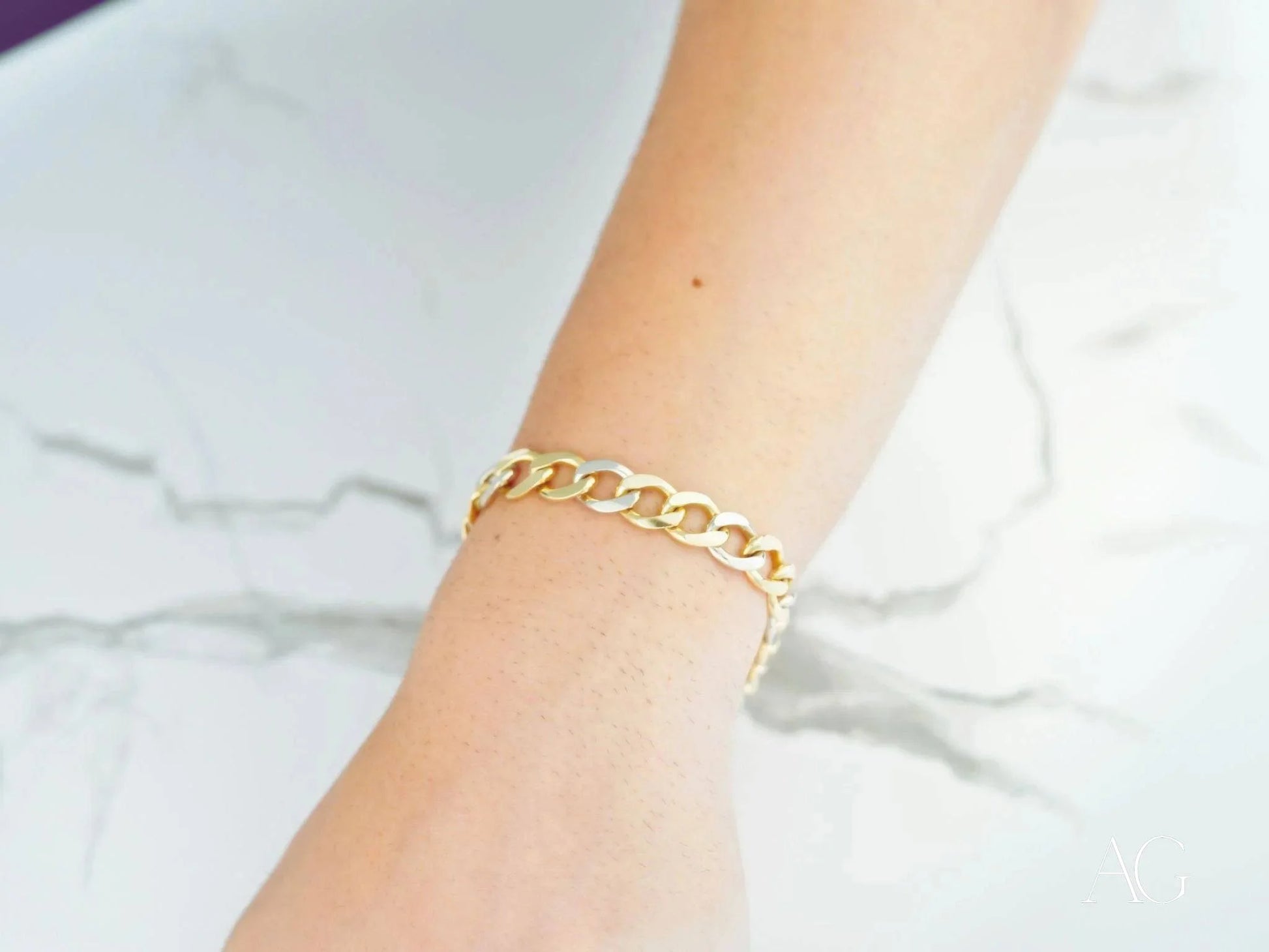 Gold chain bracelet on wrist showcasing Timeless Elegance 18k White Gold Flat Cuban design