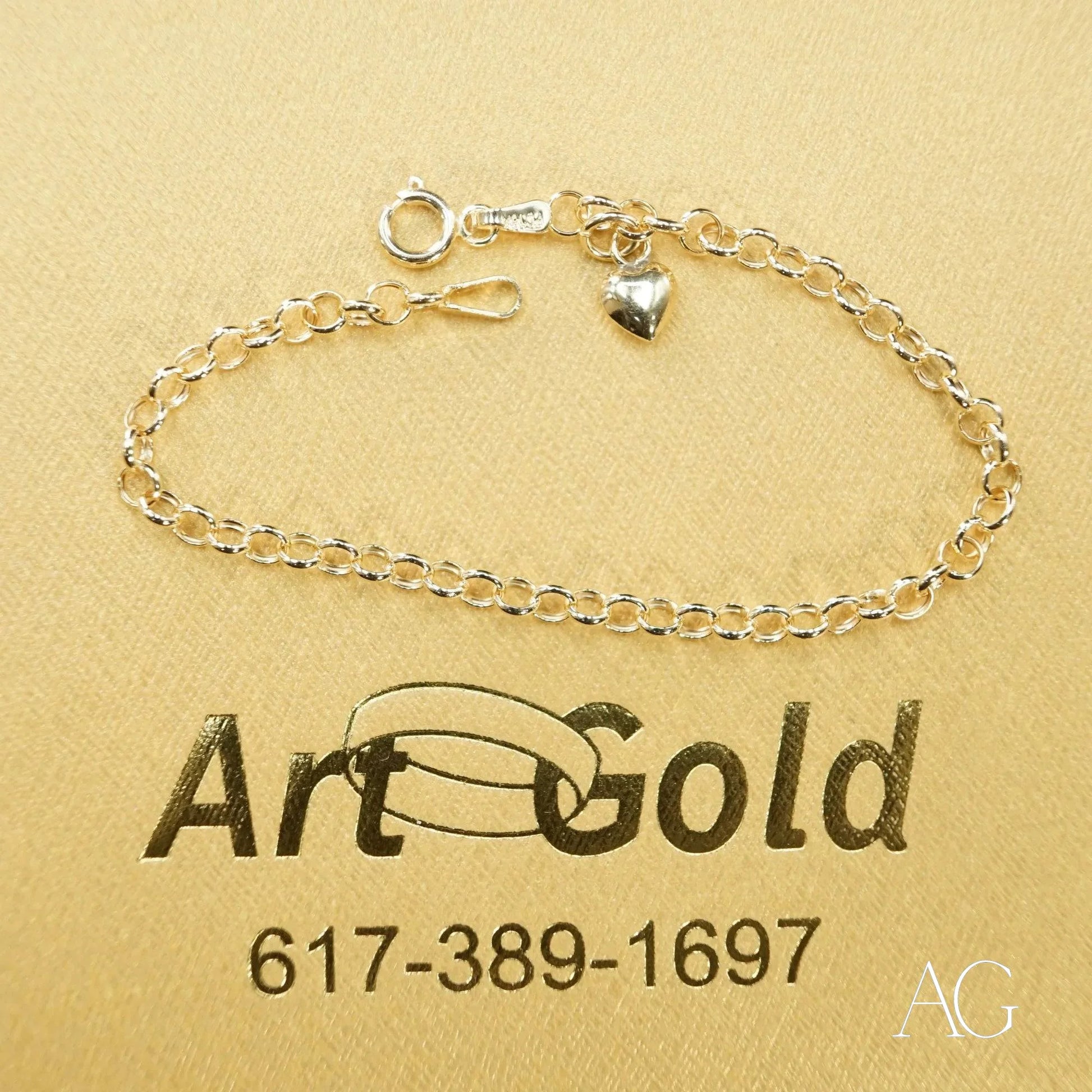 Delicate silver chain bracelet with small heart charm from Timeless 18k Gold Heart collection