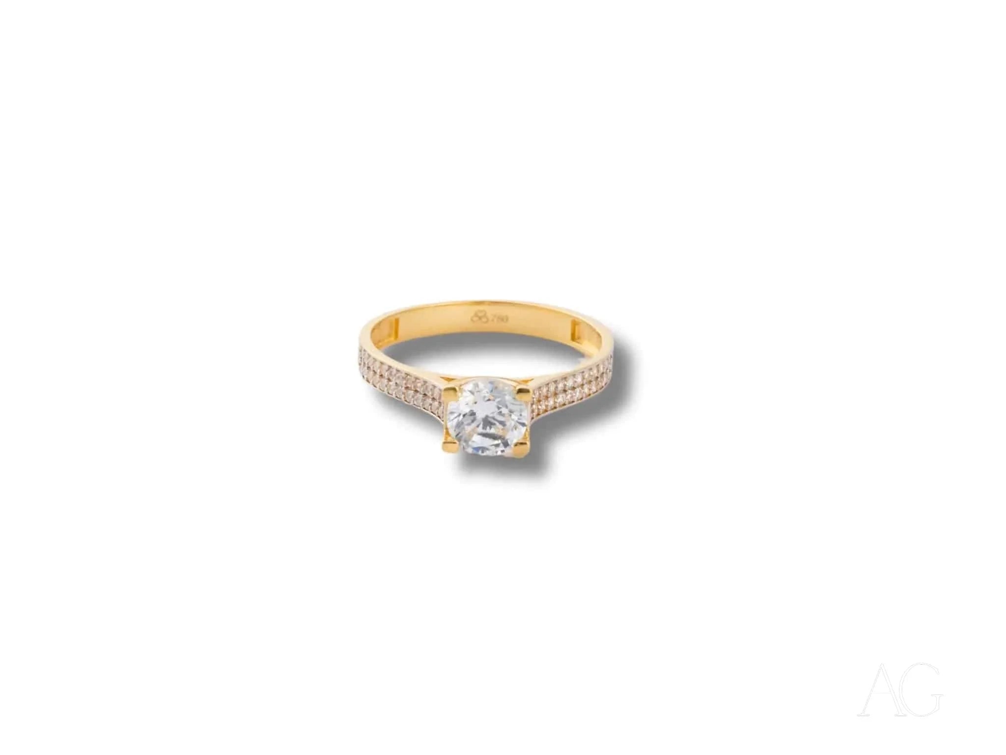 Gold engagement ring featuring a square-cut diamond in 18k yellow gold