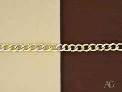 Gold flat cuban link bracelet in 18k white gold on a stylish two-toned background