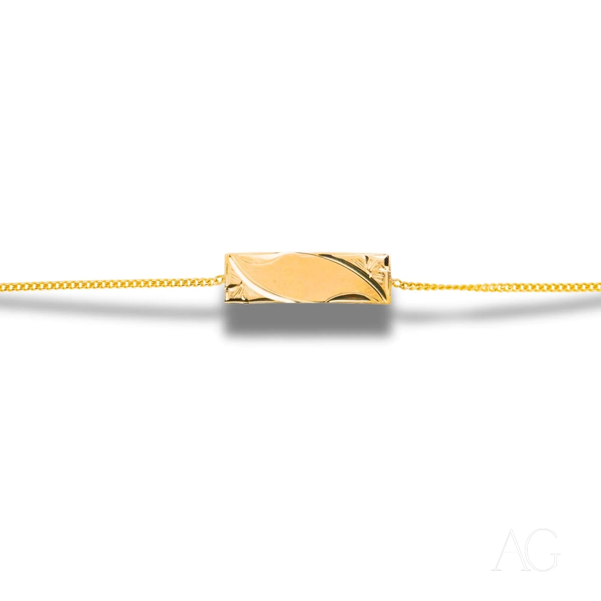 Gold pendant necklace with sleek charm on delicate chain in 18k solid gold design