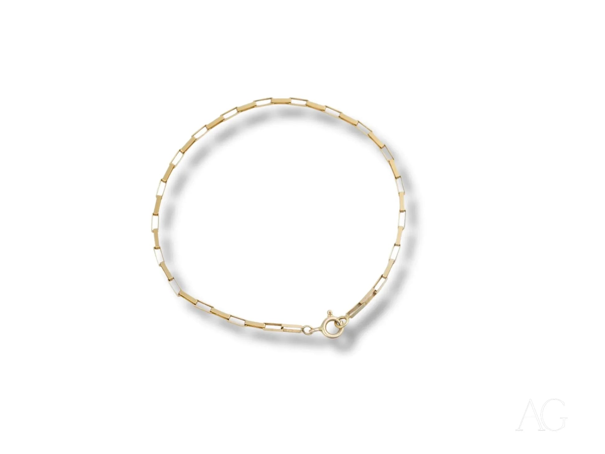 Delicate gold and white beaded bracelet showcasing a solid 18k gold brick link design