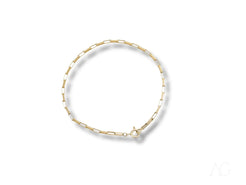 Delicate gold and white beaded bracelet showcasing a solid 18k gold brick link design