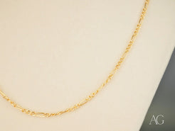 Timeless Sophistication 18K Gold Semi-Solid Figaro Chain showcasing elegance and style