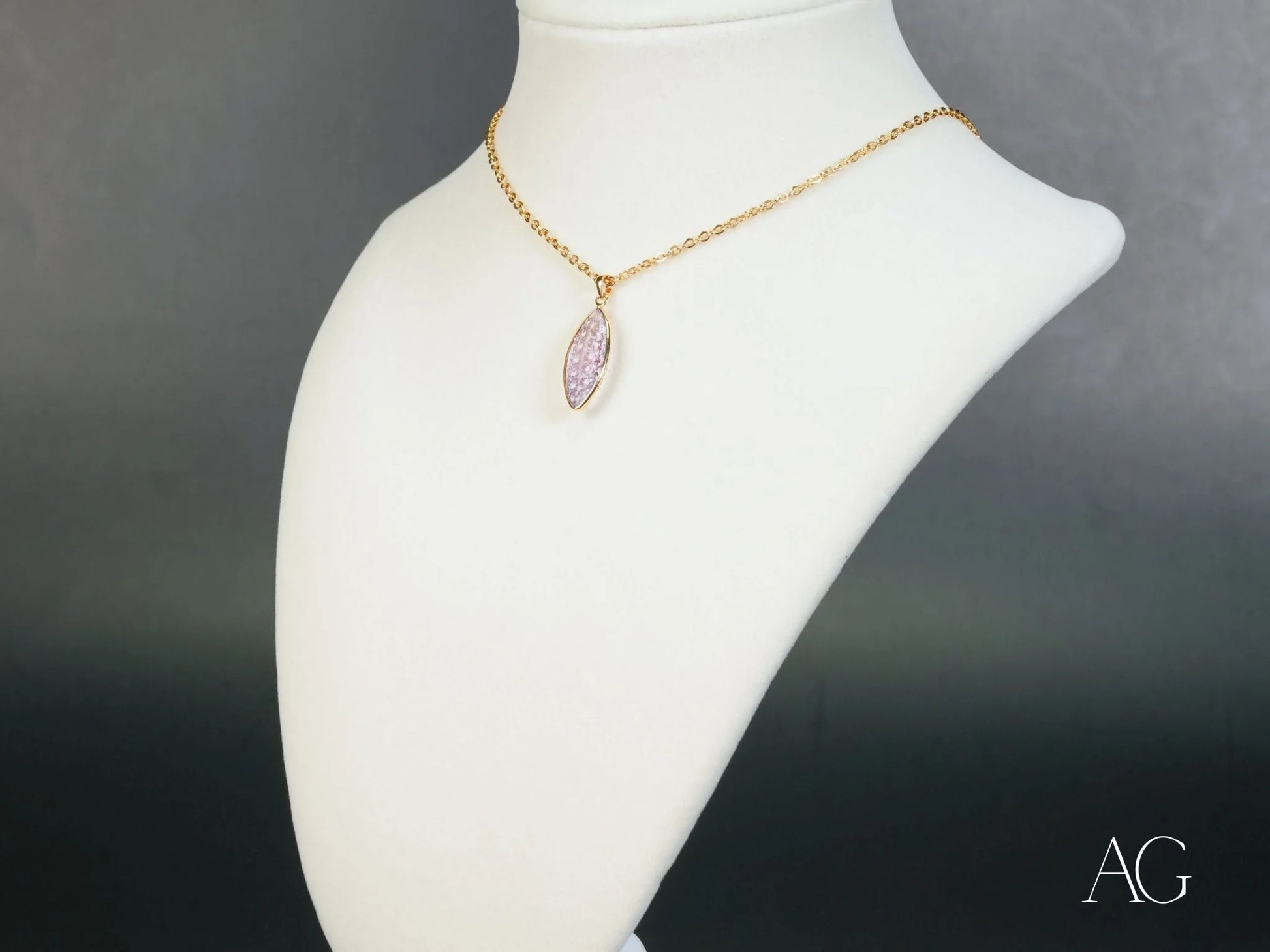 Gold-plated 18k gold necklace with Violet Essence Amethyst gemstone pendant on display