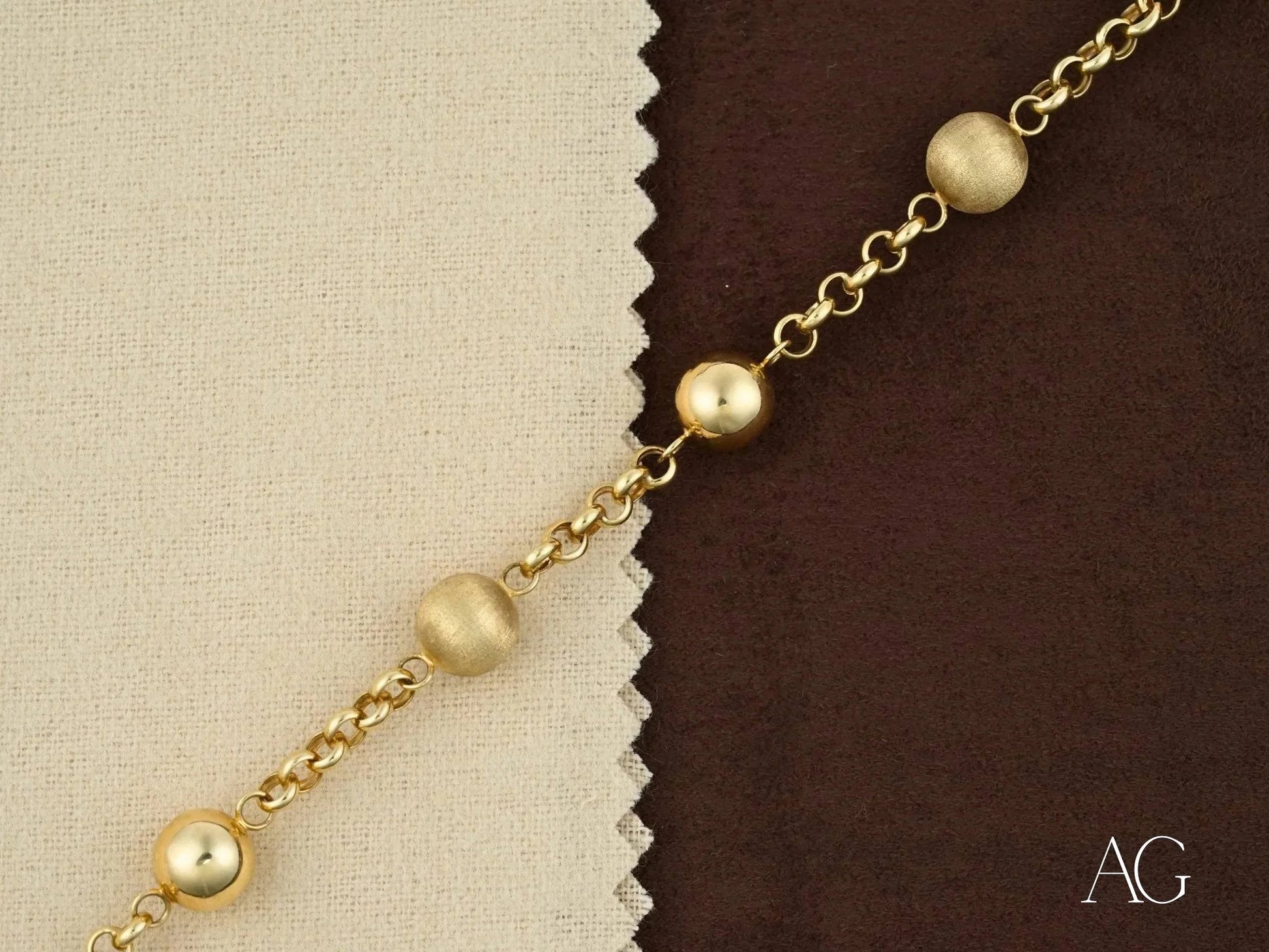 Gold chain bracelet with spherical beads featuring a spring ring clasp for women