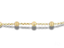 Gold chain necklace with round beads and links featuring a spring ring clasp